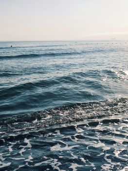 Gentle waves and tranquil waters at sunrise in Samsun, Türkiye. Perfect for serene and peaceful themes.