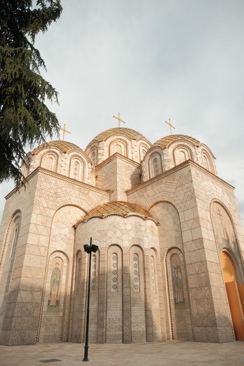 Free Sunlit exterior of a historic church in Skopje, showcasing intricate Byzantine architecture. Stock Photo