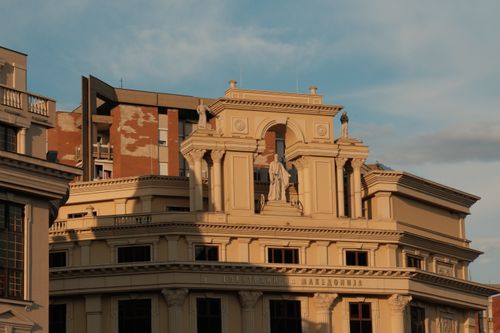 Free Neoclassical building facade in Skopje, North Macedonia at sunset. Stock Photo