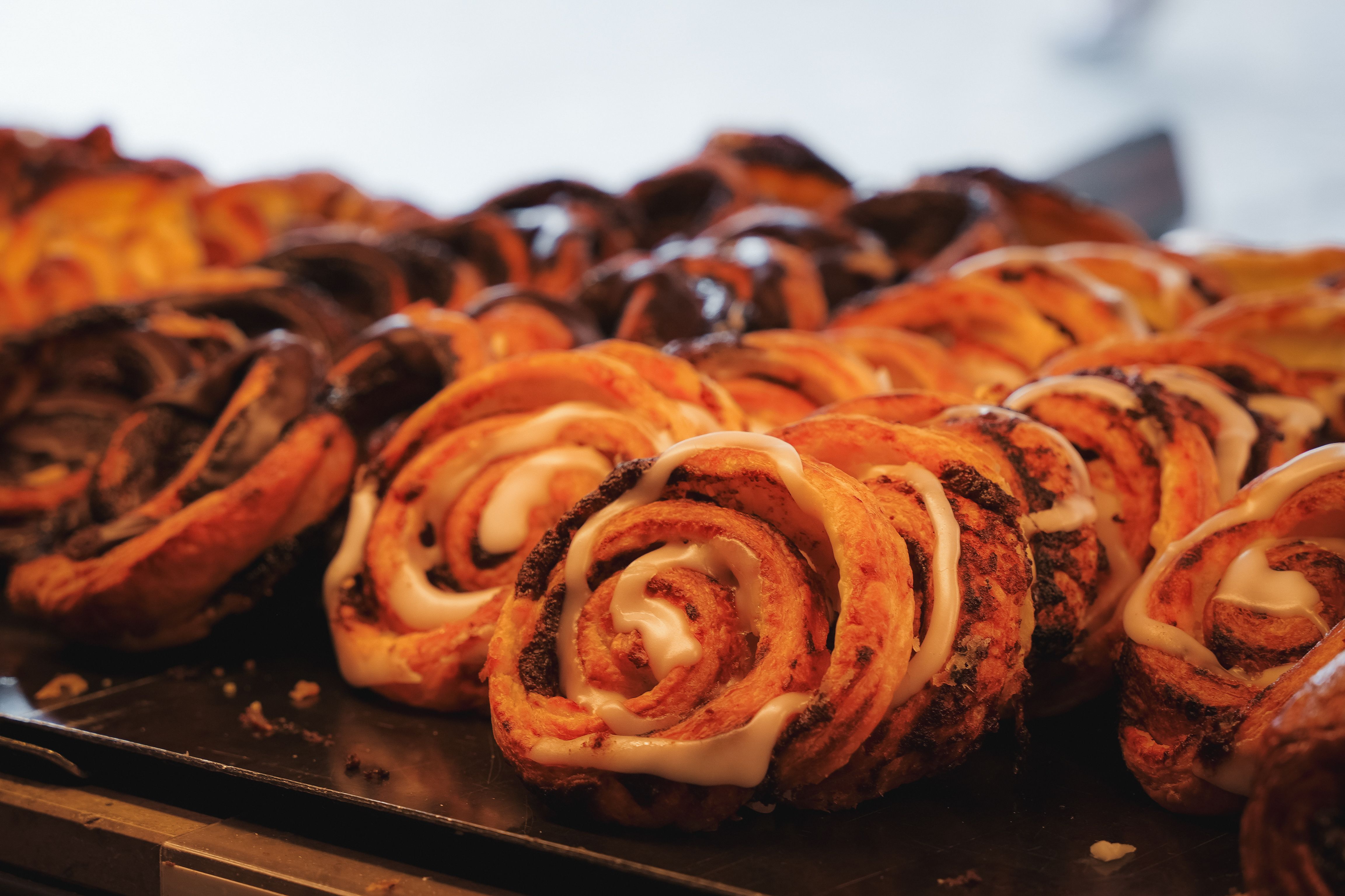 Freshly baked Danish pastries displayed in a Copenhagen bakery, showcasing traditional flavors and textures.