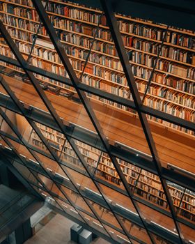 A stunning aerial view of a modern library interior, showcasing elegant architecture and rows of bookshelves.