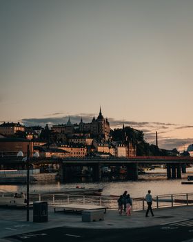 Beautiful cityscape of Stockholm with sunset over the water and historic architecture.