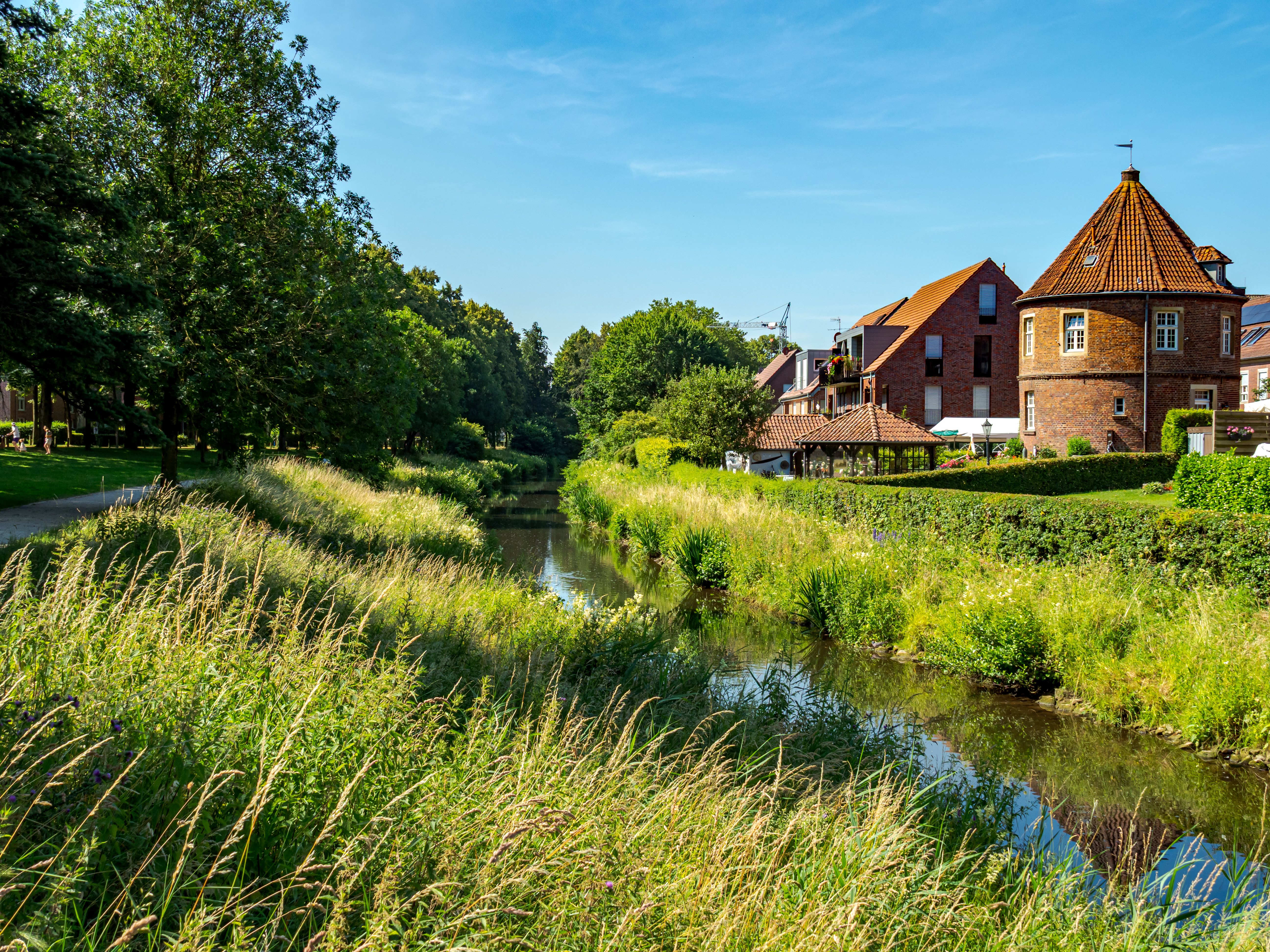 Picturesque summer landscape in Coesfeld, Germany with lush greenery and historic architecture.