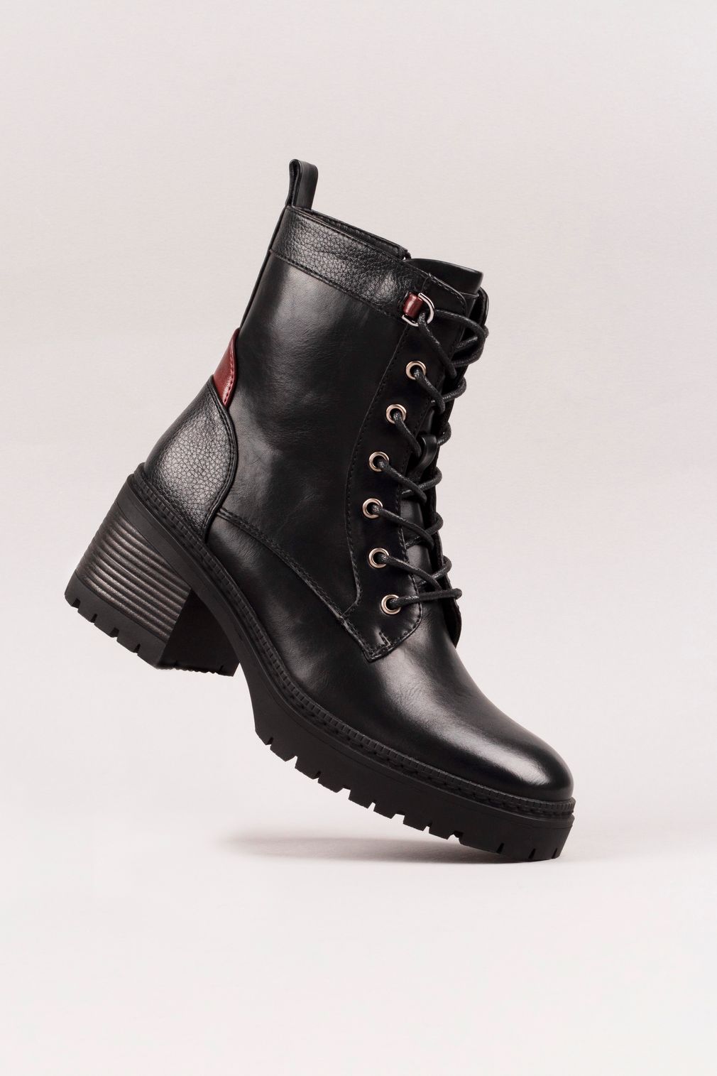 Sedge lace-up leather ankle boot on a bone-pale studio sweep — photo by Lee Hanson on Pexels
