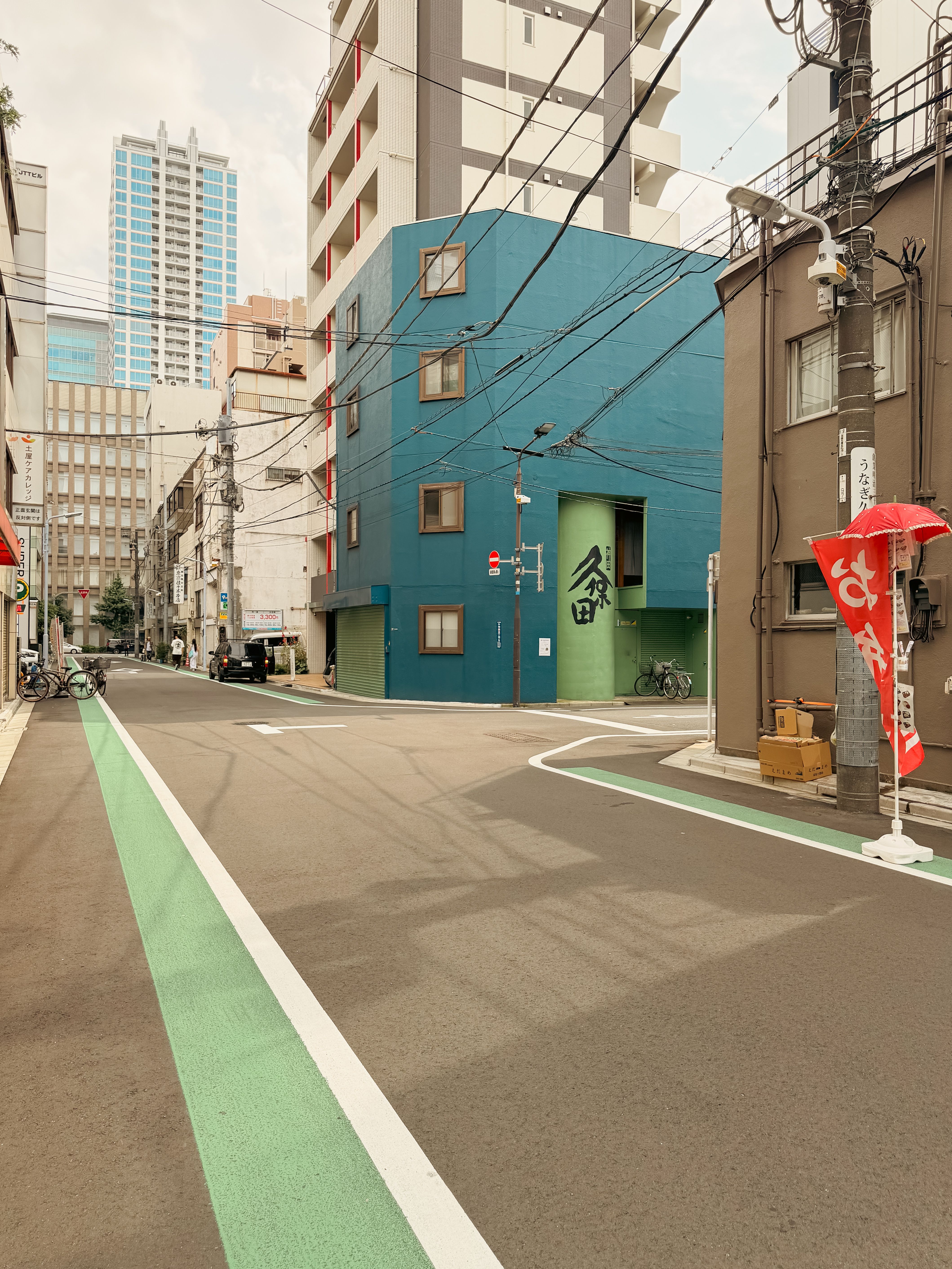 Vibrant street view in Tokyo, showcasing modern and traditional architecture.