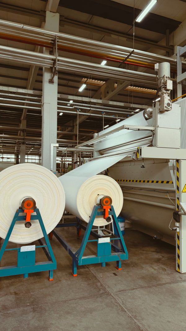 Industrial textile machinery with large spools