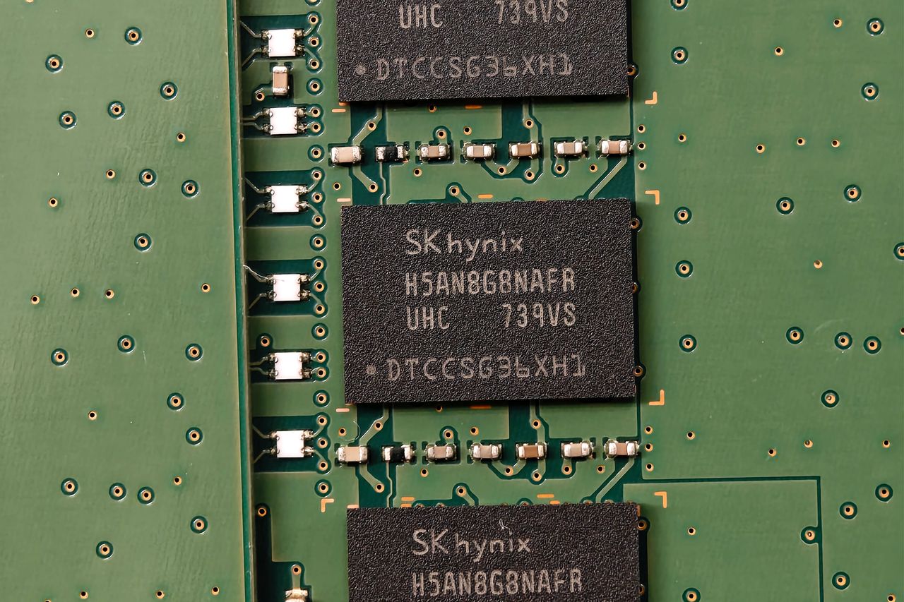Detailed view of SK hynix DRAM chips on a green circuit board featuring electronic components.