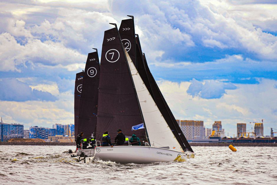 Outstanding 4 Hours 38ft Reel Dreams Private Charter in Nassau Review: Your Ultimate Bahamas Adventure Awaits Review 2026 - Sailboats racing on a bustling waterway against a city backdrop, capturing the thrill of competitive yachting.