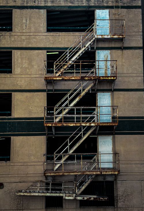 Free Vertical view of a rustic fire escape on an old urban building in Fort Worth, Texas. Stock Photo