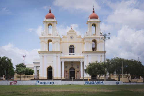 Free A beautiful view of a historic church in Santo Domingo, Heredia, Costa Rica, under a bright sky. Stock Photo