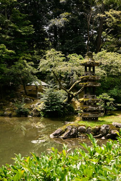 Free Peaceful landscape of Kenrokuen Garden with traditional stone lantern in Kanazawa, Japan. Stock Photo