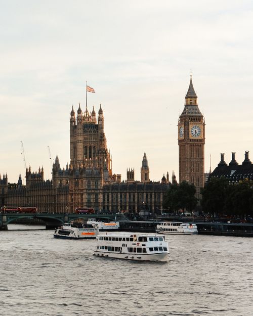Free Iconic view of Big Ben and Westminster Palace from the River Thames, London, United Kingdom. Stock Photo