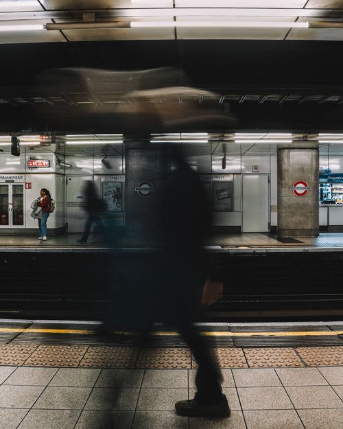 Free Dynamic scene in London Underground with people in motion, creating a busy urban vibe. Stock Photo