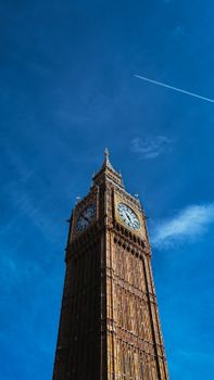 Stunning view of Big Ben with a vibrant blue sky in London, England.