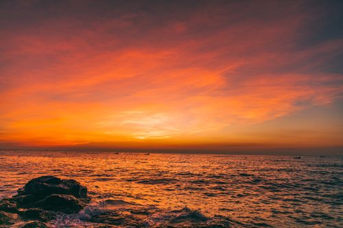 Free Mesmerizing sunset sky with vivid orange hues over Quảng Trị's ocean horizon. Stock Photo