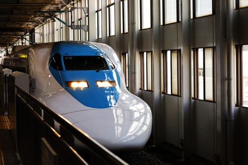Free A sleek Shinkansen train at Hiroshima Station in Japan, capturing modern high-speed rail travel. Stock Photo
