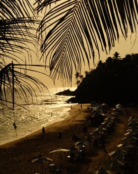 Scenic view of Praia do Porto da Barra at sunset, Bahia's picturesque beachfront.