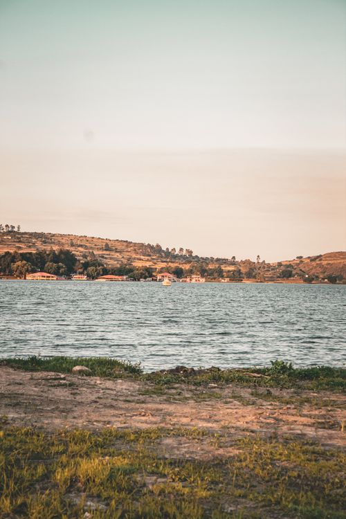 Free Tranquil lake scene with lush hills in Villa del Carbón, Mexico, during a sunny day. Stock Photo