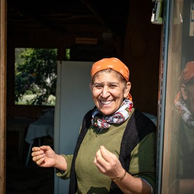 Cheerful woman in a scarf and headband — photo by Hakan Sapci on Pexels