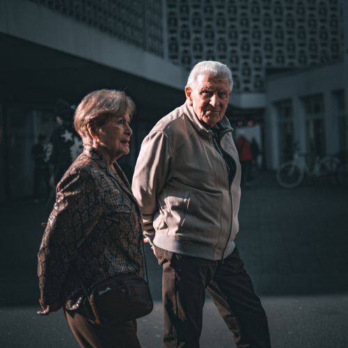 Free Elderly couple strolling in Trier, Germany during daytime. Stock Photo