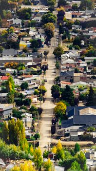 A picturesque aerial view of Esquel, Argentina, showcasing its residential landscape during fall.