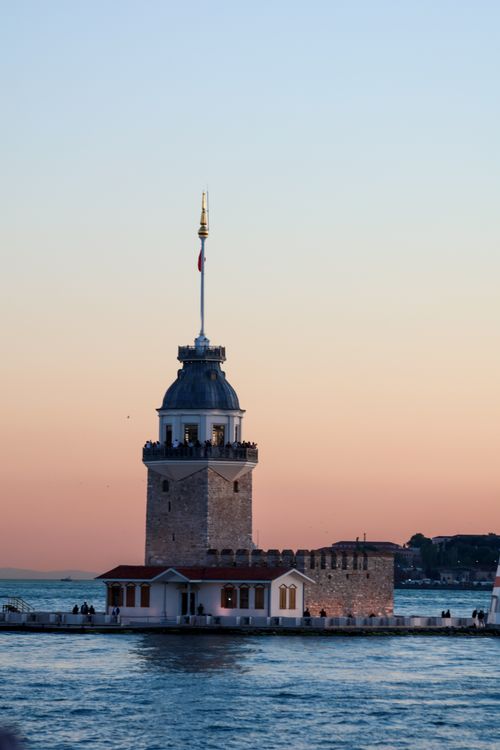 Free Scenic view of Maiden's Tower with colorful sunset sky in Istanbul, Turkey. Stock Photo