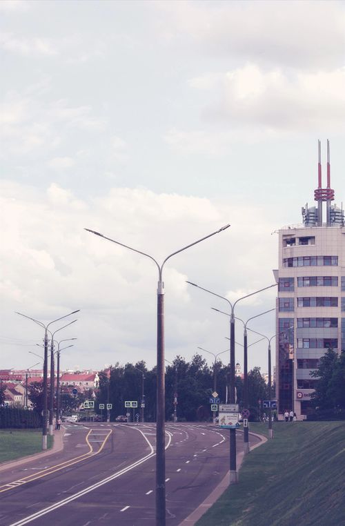 Free Cityscape view of Minsk showing street, building architecture, and overcast sky. Stock Photo