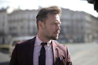 Portrait Photo of Man in Brown Suit Jacket Looking Away