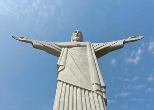 Free Close-up view of the iconic Christ the Redeemer statue against a blue sky in Rio de Janeiro. Stock Photo