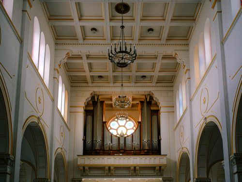 Free Beautiful church interior showcasing a grand pipe organ and architectural elegance. Stock Photo
