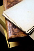 Worn leather-bound book cover, photo by Marta Branco on Pexels
