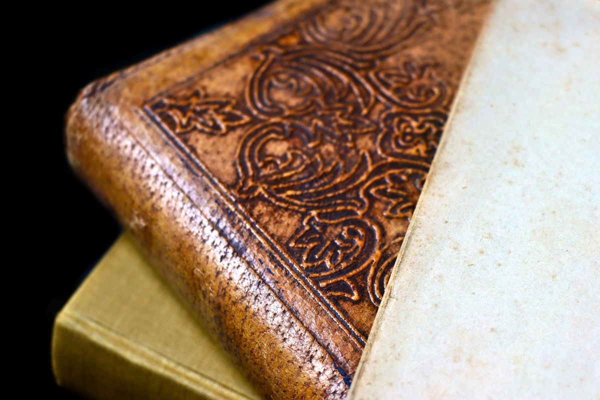 Ornate tooled leather binding photographed in raking light