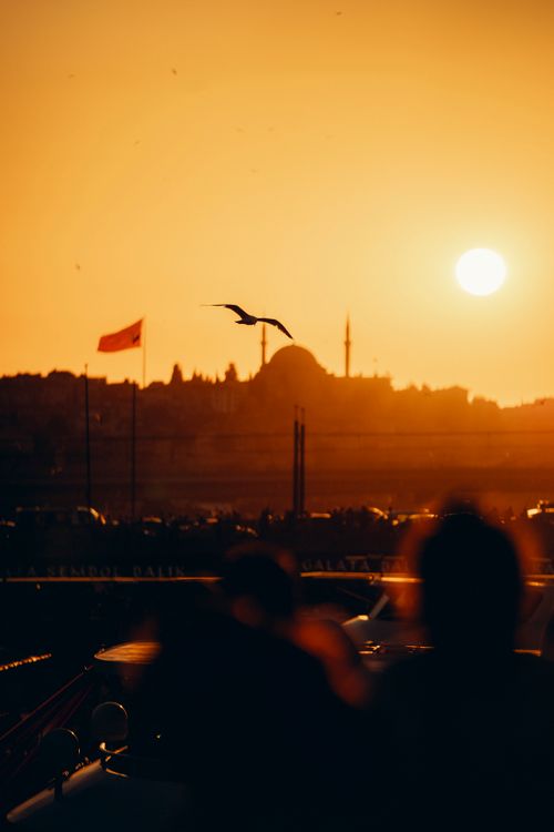 Free A mesmerizing sunset with silhouettes of Istanbul's skyline capturing its historic charm. Stock Photo