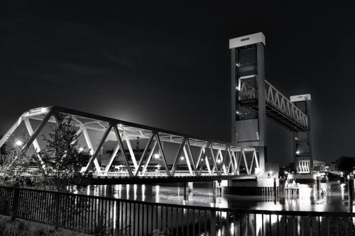 Free Captivating black and white photo of a lifting bridge at night, showcasing architectural elegance. Stock Photo
