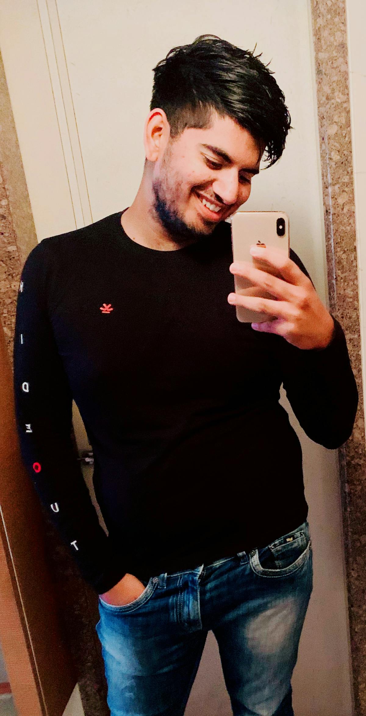 Young man performing a squat with good form and focus