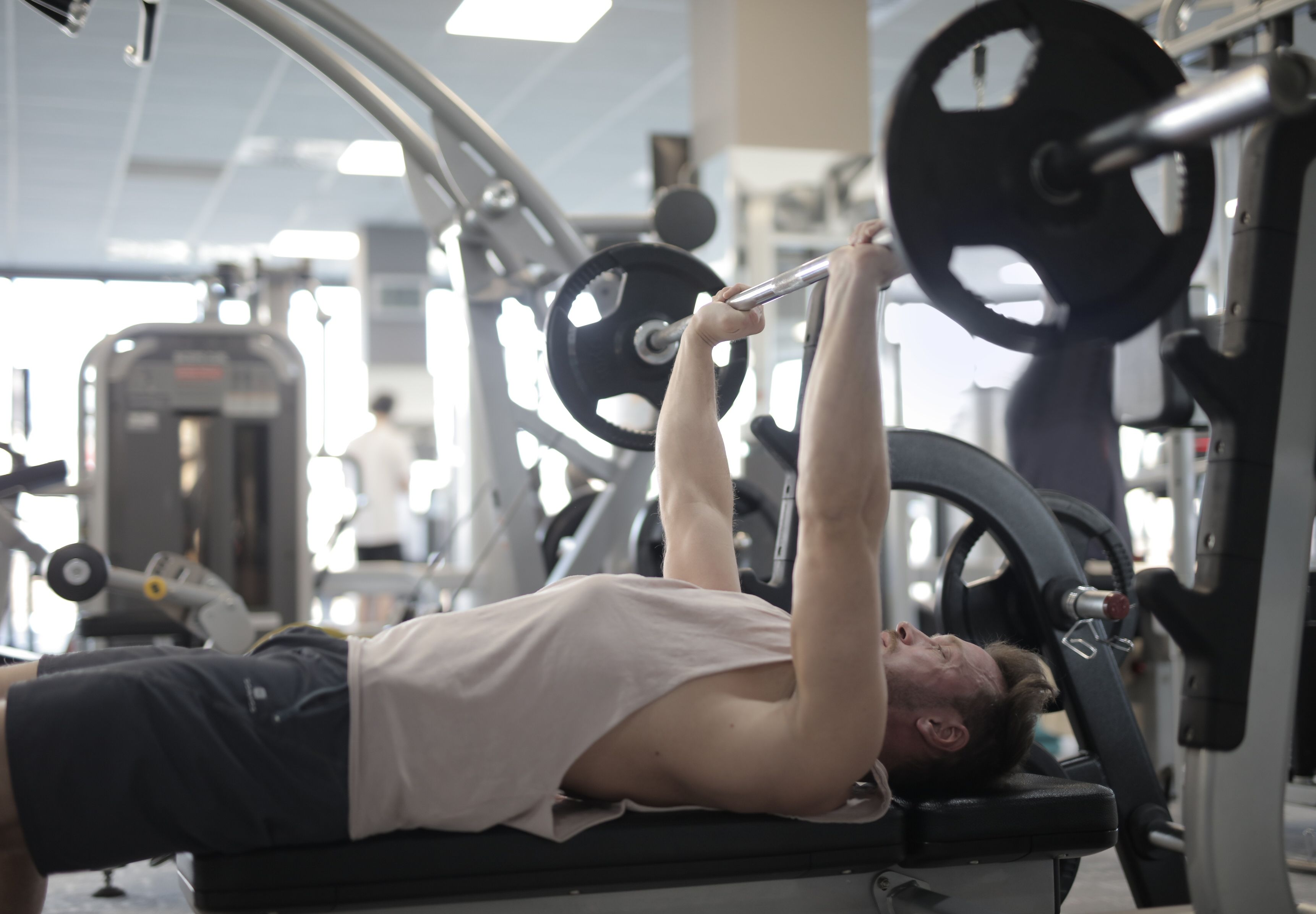 An athlete working through presses on the frame