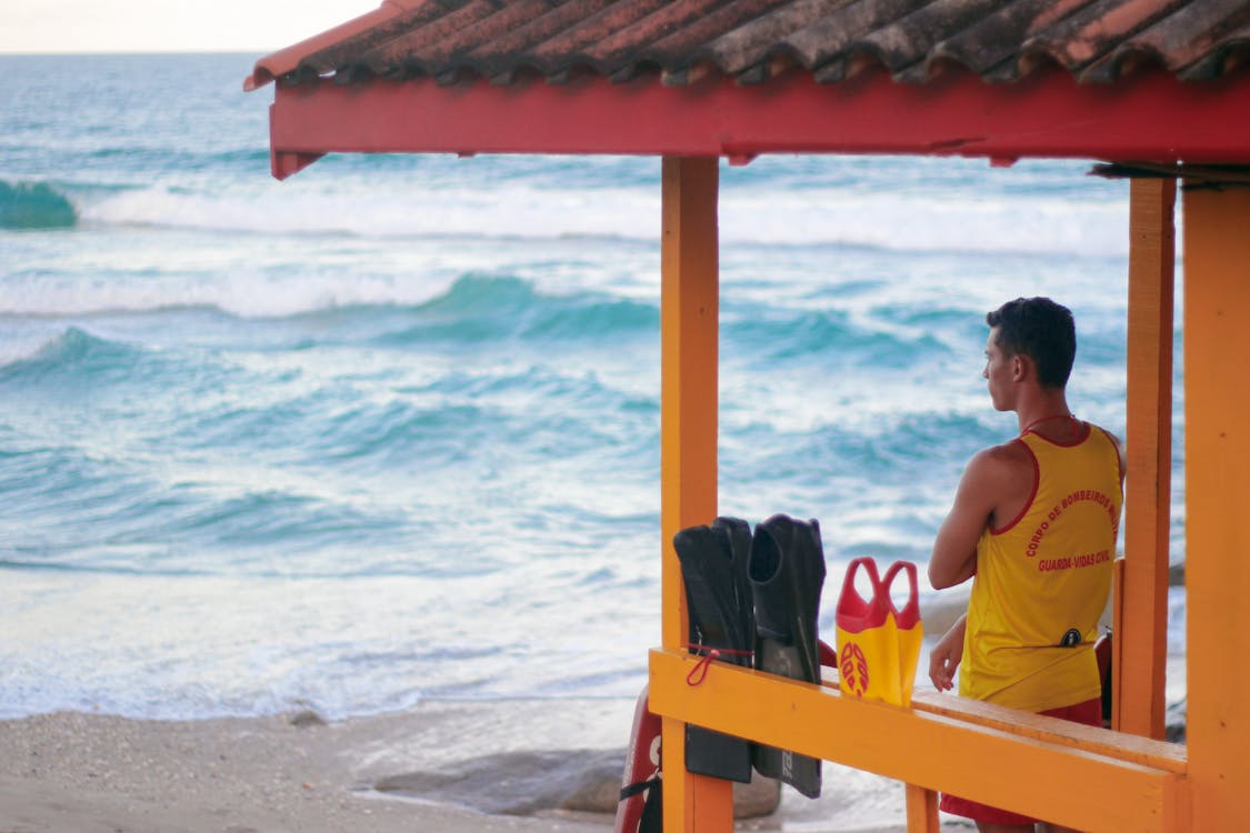 Free Lifeguard Standing Near Beach Stock Photo