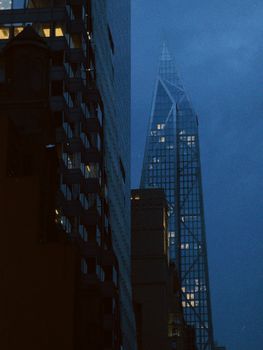 Dramatic nighttime cityscape showcasing the striking New York City skyline with modern skyscrapers.