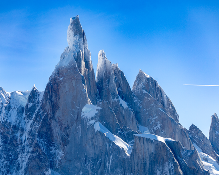 A stunning view of the Cerro Torre peak in Patagonia, Argentina, during daylight.