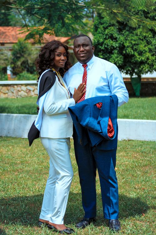 Free Stylish couple in formal wear posing outdoors on a sunny day. Perfect for lifestyle themes. Stock Photo