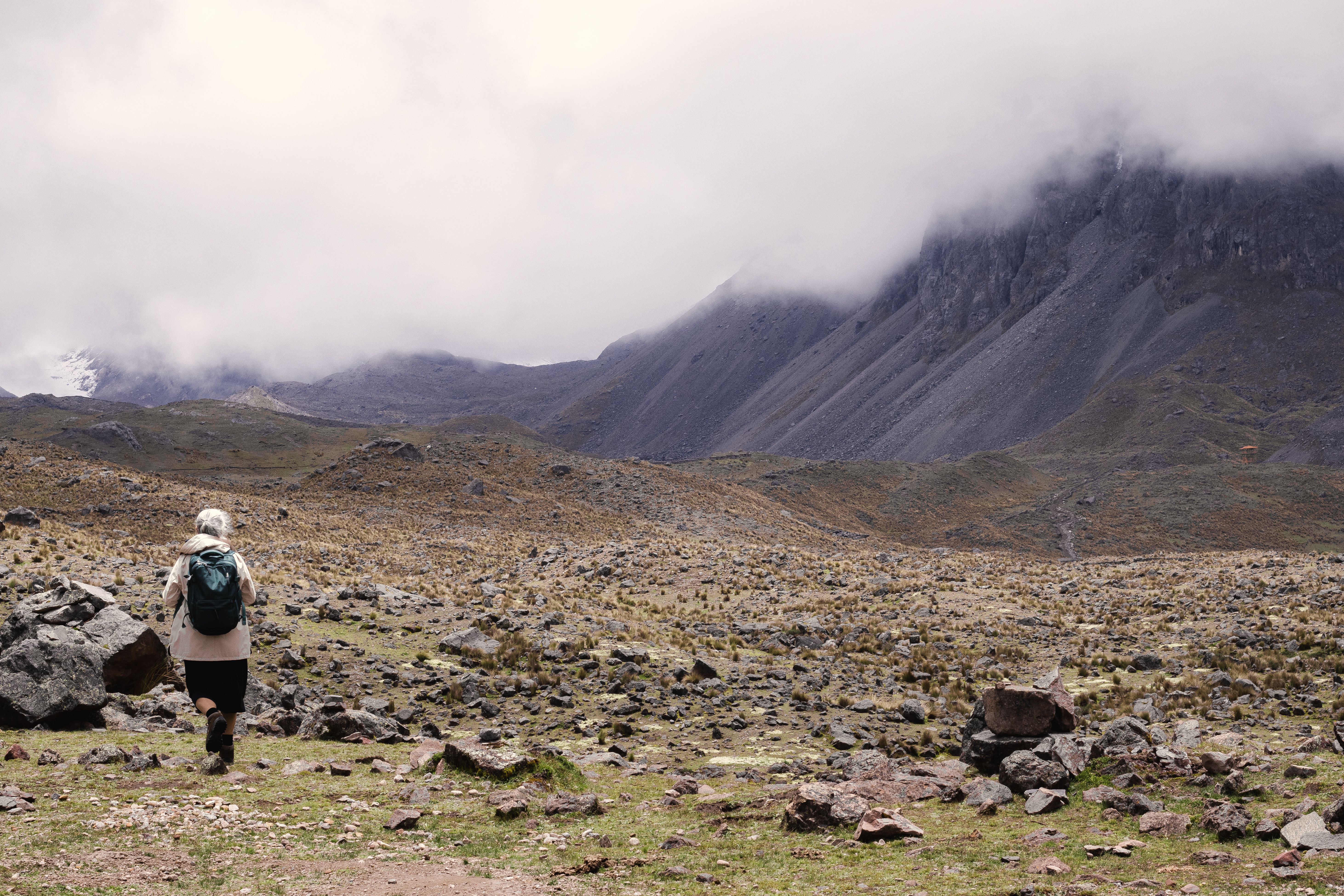 Breathtaking 10-day Galapagos Island Hopping Adventure Expedition Review 2026 - A traveler explores the rugged landscape of the Peruvian Andes under a cloudy sky.