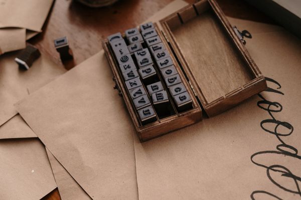 Boxed set of hand-cut alphabet stamps, photo by cottonbro studio on Pexels