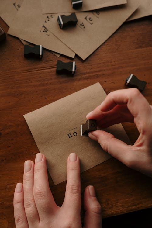 Person Holding White Printer Paper