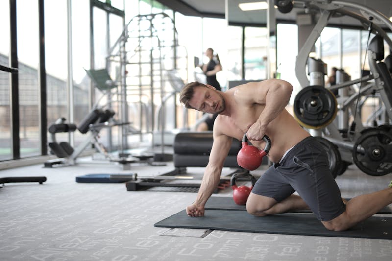 Row of dumbbells in a well-equipped gym