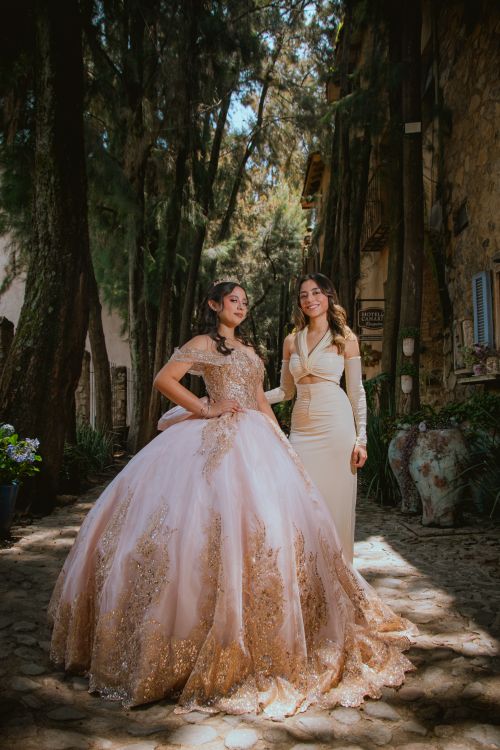 Free Two women in formal dresses, captured in a charming Val'Quirico, México setting. Stock Photo