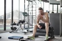Athlete resting after a workout at the gym