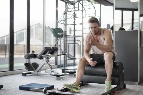 Athlete resting after a workout at the gym