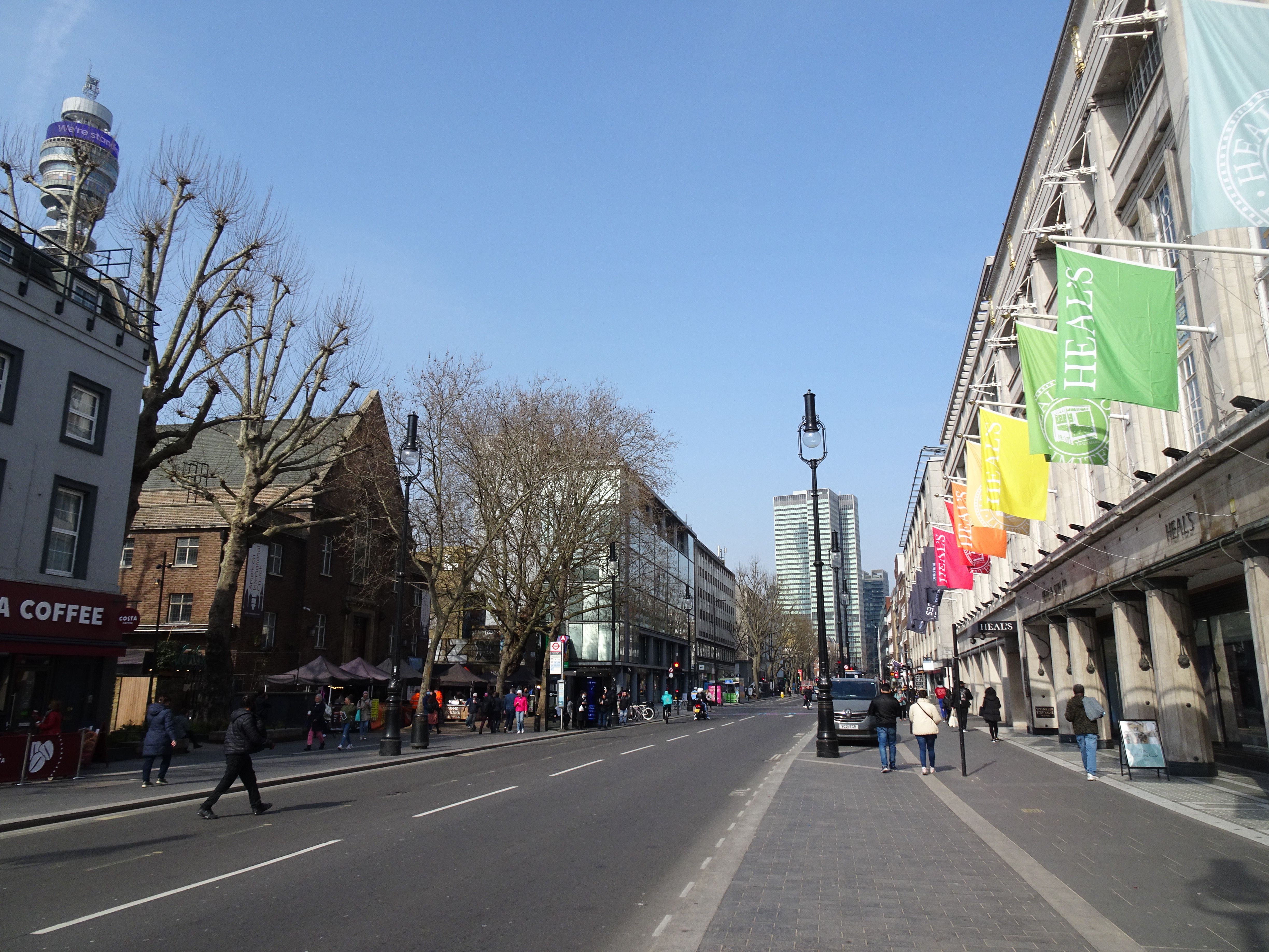 Explore a vibrant London street scene with the iconic BT Tower in the backdrop, bustling with life.