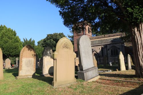 Free Peaceful graveyard and church in Swettenham, England, bathed in sunlight. Stock Photo