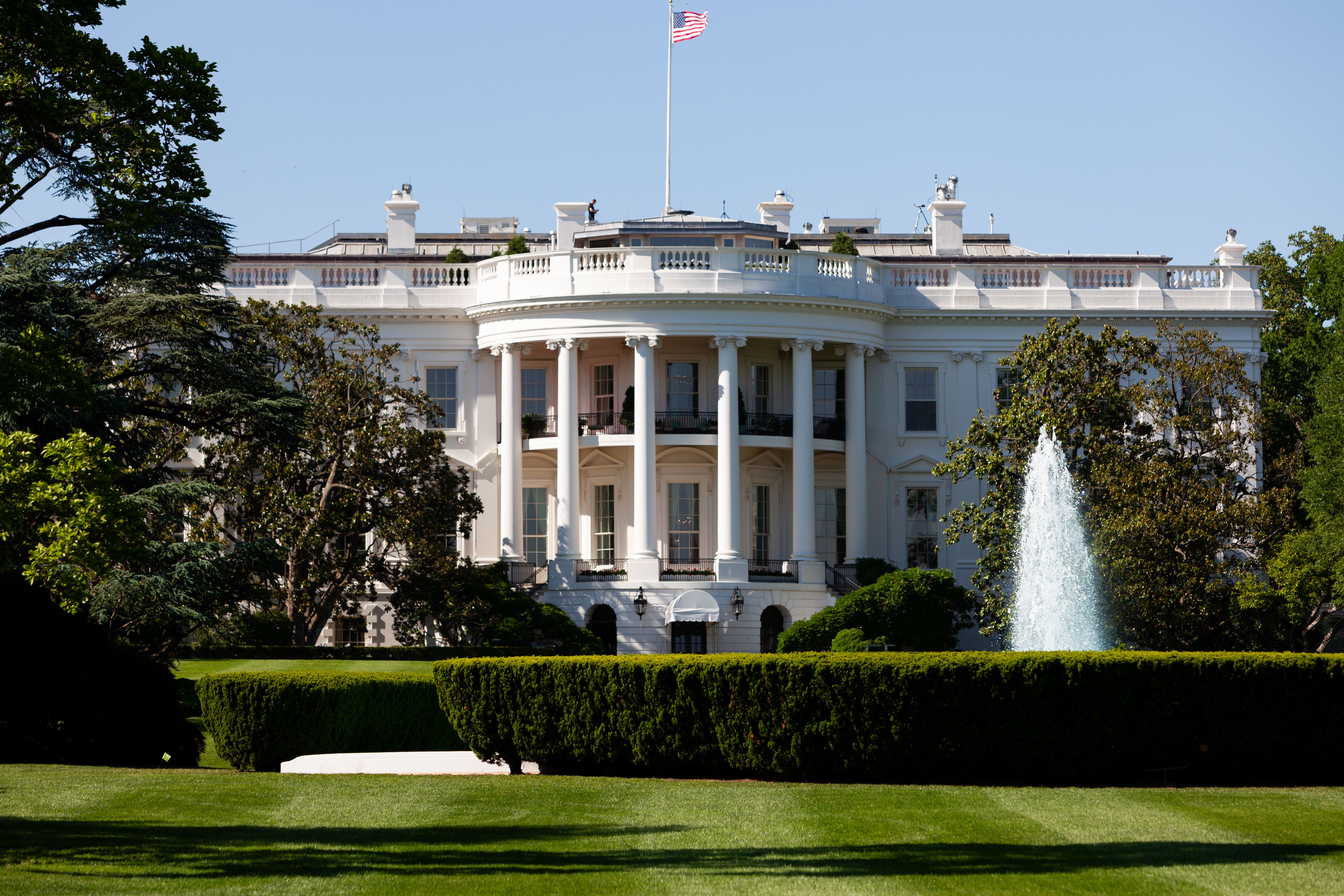 The White House South Portico with a fountain on a sunny day in Washington, DC.